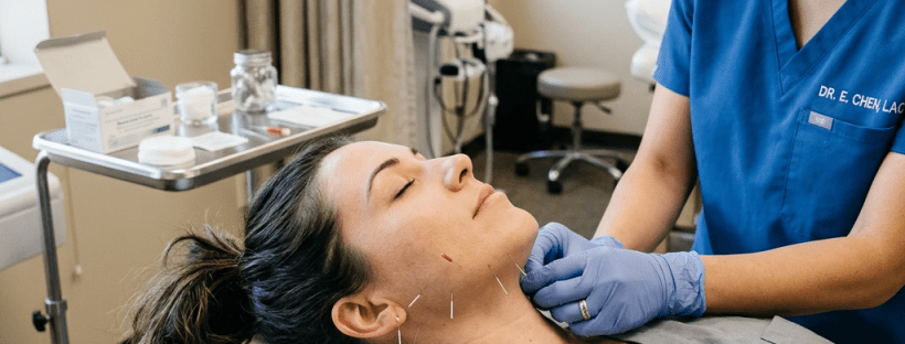 Patient receiving neck acupuncture treatment from a practitioner in medical office